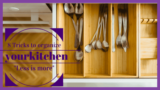 Open kitchen drawer with organized spoons and forks in wooden dividers, featuring '8 Tricks to organize your kitchen'.